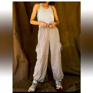 New With Tag Beige Free People Movement Back Packer Jumpsuit, Size Medium
